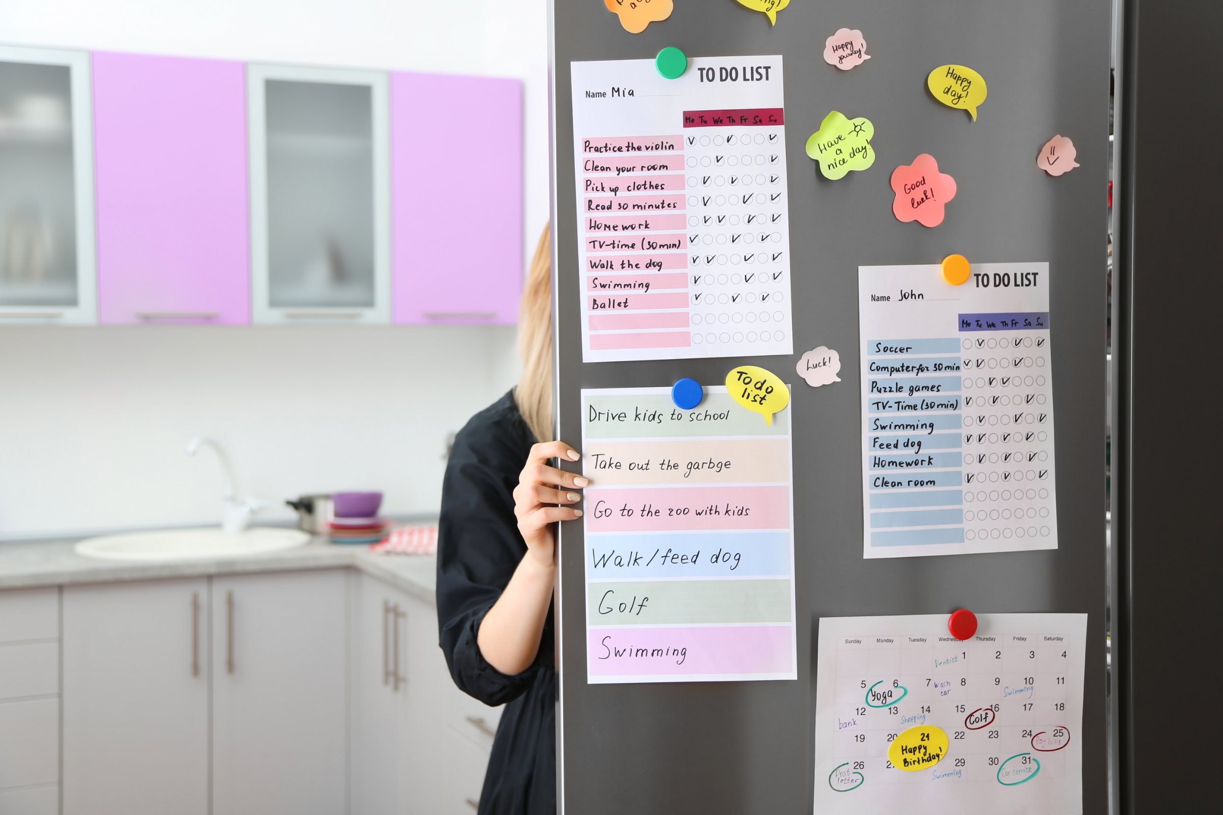 A family schedule and to-do lists on a refrigerator door